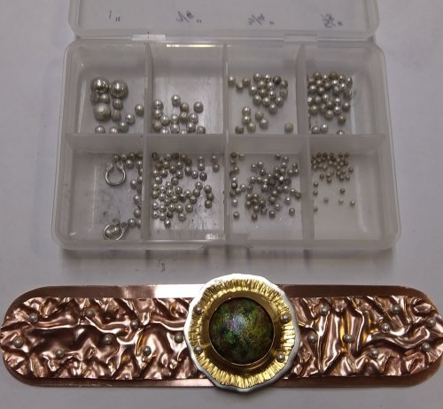 Judy Larson's Fold Formed Cuff With Faux Roman Glass or Coin Cabochon - , Metalwork, Cutting, Cutting Tool, Cutters, Dapping, Dapping Jewelry, Filing, Finishing, Forging, Forging Jewelry, Jewelry Forging, How To Punch Holes, Hole Punching, Punch A Hole, Oxidizing Wire, Oxidizing, Antiquing Wire, Antiquing, Riveting, Riveting Techniques, Wire Rivets, Sawing, Saw, Wire Saw, Texturing, Drilling, Drill, Fold Formed Faux Roman Glass Cuff